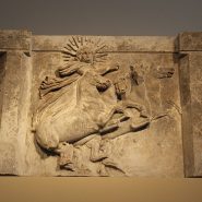 Marble relief of Sol, the Roman god of the Sun (Helios in Greek form), driving a four-horse chariot across the sky, symbolizing his daily journey.